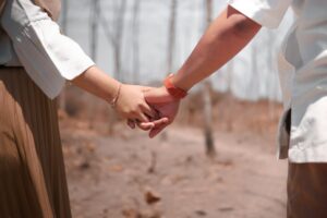 How to Deal with Differences in Your Relationship. A couple holding hands.