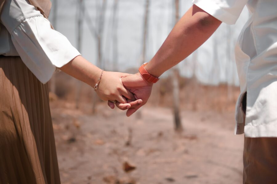 How to Deal with Differences in Your Relationship. A couple holding hands.